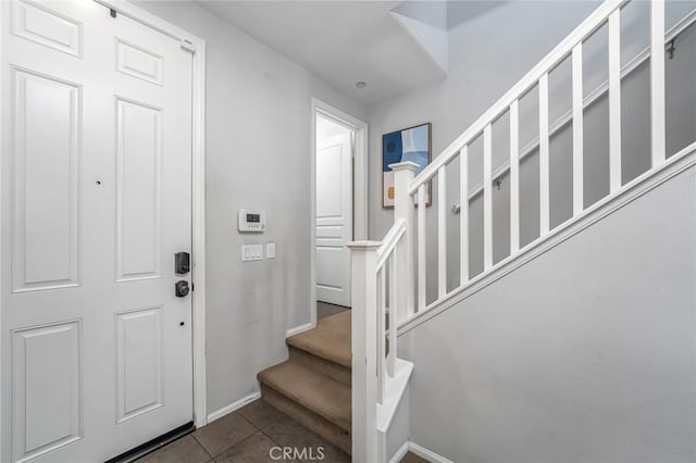 3105 E Discovery St, Ontario, CA 91762 - entrance foyer with tile patterned flooring, stairway, and baseboards