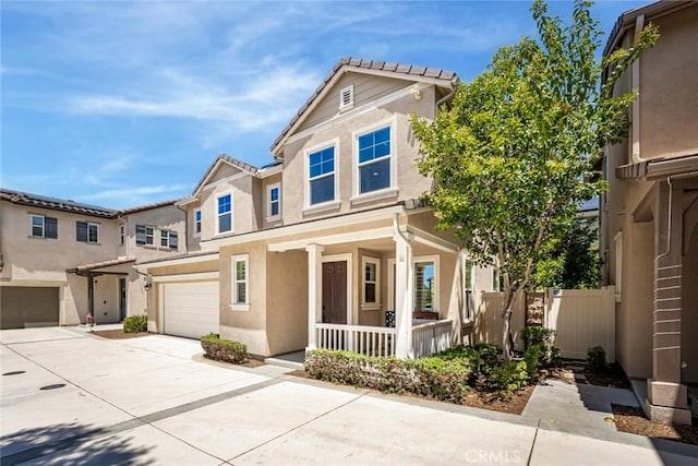 3105 E Discovery St, Ontario, CA 91762 - view of front facade featuring covered porch, an attached garage, driveway, and stucco siding