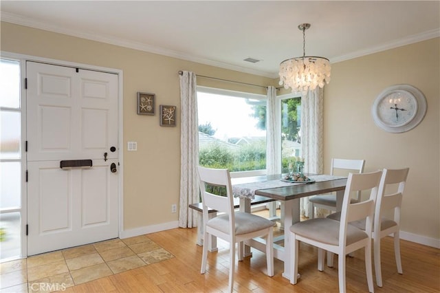 379 Camino, San Clemente, San Clemente, CA 92672 - dining space featuring a chandelier, crown molding, light wood-type flooring, and baseboards