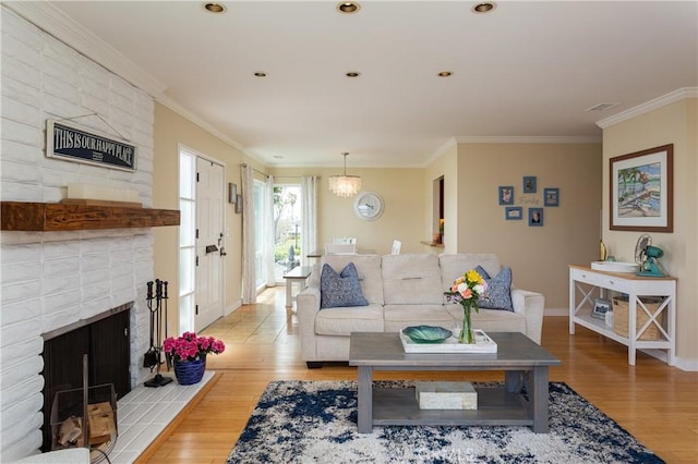 379 Camino, San Clemente, San Clemente, CA 92672 - living room featuring light wood finished floors, crown molding, baseboards, and a brick fireplace