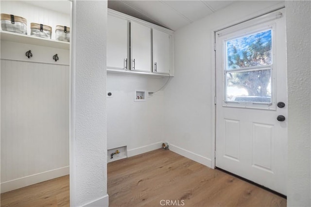 6294 Sunnyslope Rd, Phelan, CA 92371 - clothes washing area featuring hookup for a washing machine, hookup for an electric dryer, light wood-type flooring, cabinet space, and baseboards
