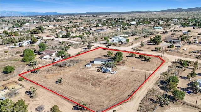 6294 Sunnyslope Rd, Phelan, CA 92371 - aerial view of sparsely populated area with property boundaries highlighted, a desert landscape, and a mountain backdrop