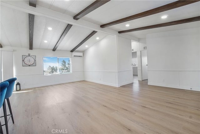 6294 Sunnyslope Rd, Phelan, CA 92371 - unfurnished living room with an AC wall unit, light wood-type flooring, recessed lighting, baseboards, and a decorative wall