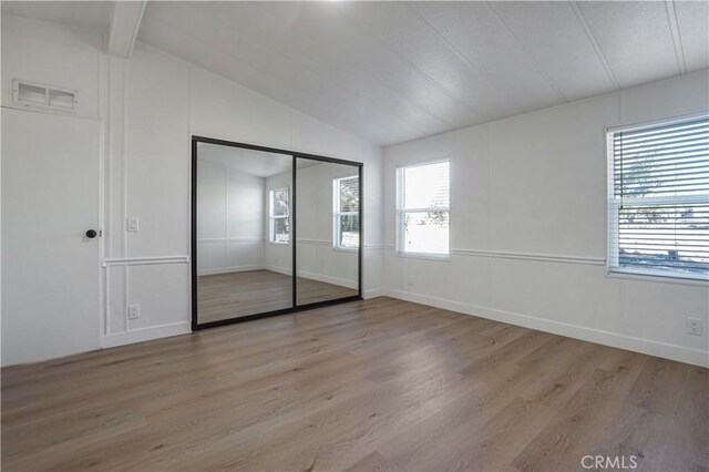 6294 Sunnyslope Rd, Phelan, CA 92371 - unfurnished bedroom featuring light wood finished floors and a closet