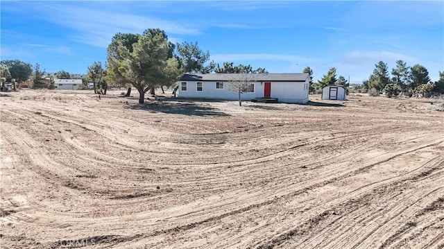 6294 Sunnyslope Rd, Phelan, CA 92371 - view of yard featuring a storage shed and an outbuilding