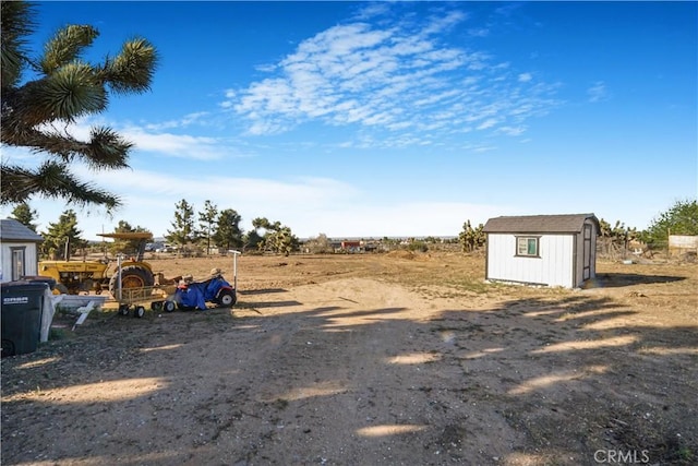 6294 Sunnyslope Rd, Phelan, CA 92371 - view of yard featuring a storage unit and an outbuilding