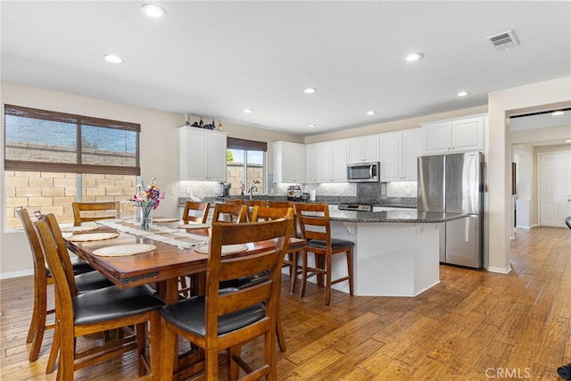 27335 Wedgewood Way, Murrieta, CA 92562 - dining space with light wood-style floors, recessed lighting, and baseboards