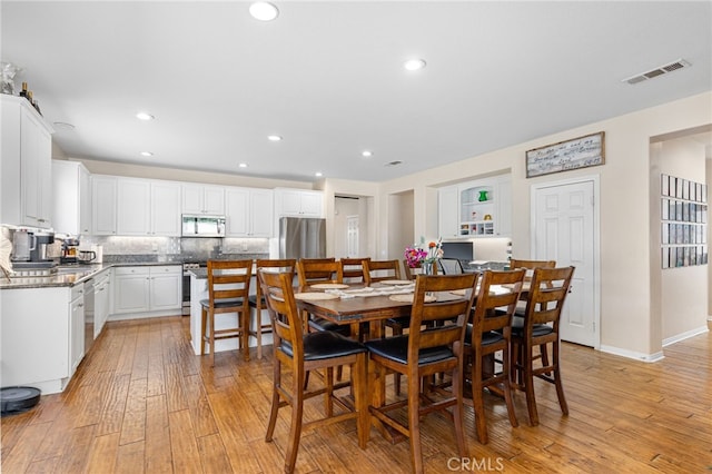 27335 Wedgewood Way, Murrieta, CA 92562 - dining room with light wood-type flooring and recessed lighting