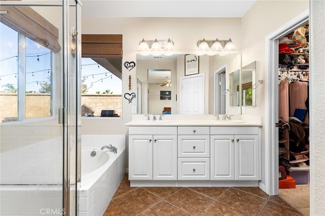 27335 Wedgewood Way, Murrieta, CA 92562 - full bath with double vanity, a garden tub, a spacious closet, tile patterned floors, and a stall shower