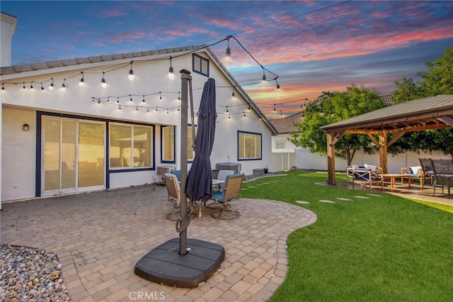 27335 Wedgewood Way, Murrieta, CA 92562 - back of house at dusk featuring a gazebo, stucco siding, and a patio