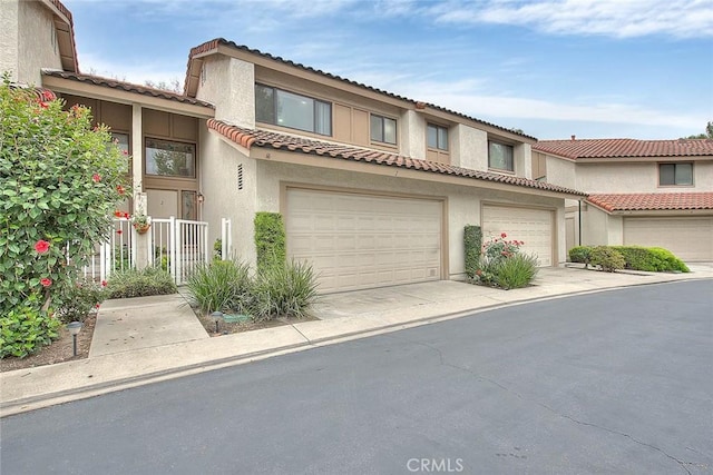 23020 Paseo De Terrado Unit 2, Diamond Bar, CA 91765 - view of front of home featuring stucco siding, a tiled roof, and driveway