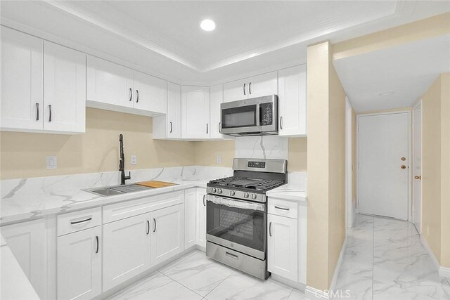 23020 Paseo De Terrado Unit 2, Diamond Bar, CA 91765 - kitchen with stainless steel appliances, light marble finish floors, a sink, white cabinets, and recessed lighting