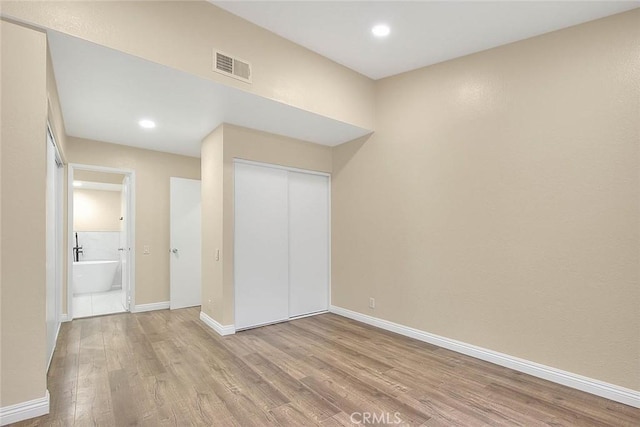 23020 Paseo De Terrado Unit 2, Diamond Bar, CA 91765 - unfurnished bedroom with wood finished floors, recessed lighting, a closet, and baseboards