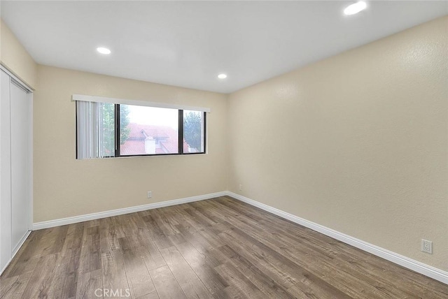 23020 Paseo De Terrado Unit 2, Diamond Bar, CA 91765 - unfurnished bedroom with wood finished floors, baseboards, recessed lighting, and a closet