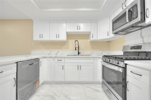 23020 Paseo De Terrado Unit 2, Diamond Bar, CA 91765 - kitchen with stainless steel appliances, a tray ceiling, a sink, light marble finish floors, and crown molding