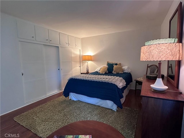 253 Calle Aragon Unit F, Laguna Woods, CA 92637 - bedroom featuring wood finished floors and baseboards