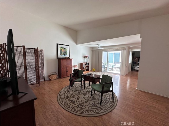 253 Calle Aragon Unit F, Laguna Woods, CA 92637 - living area featuring wood finished floors, ceiling fan, and baseboards