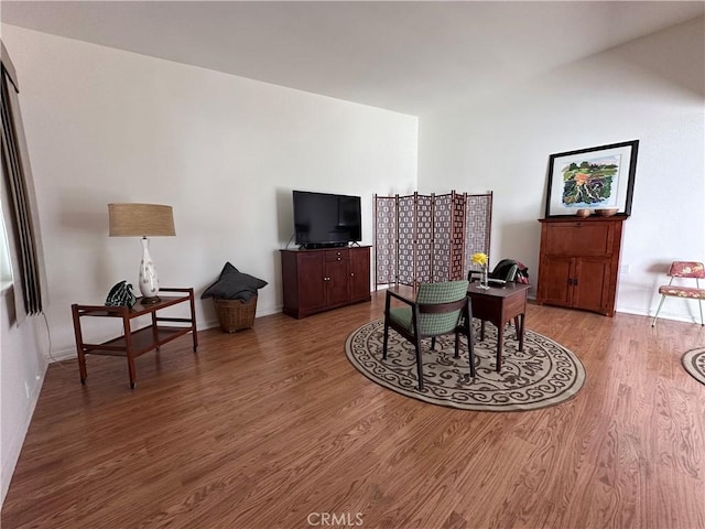 253 Calle Aragon Unit F, Laguna Woods, CA 92637 - living room featuring wood finished floors