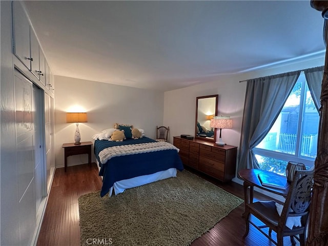 253 Calle Aragon Unit F, Laguna Woods, CA 92637 - bedroom with dark wood-style flooring