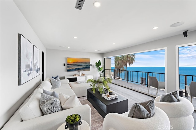 31423 S Coast Hwy Unit 22, Laguna Beach, CA 92651 - living area with a water view, recessed lighting, healthy amount of natural light, and wood finished floors