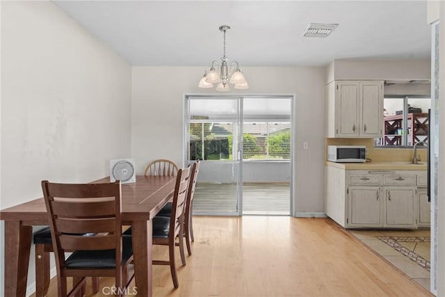 281 Harruby Dr, Calimesa, CA 92320 - dining space featuring a chandelier and light wood-type flooring