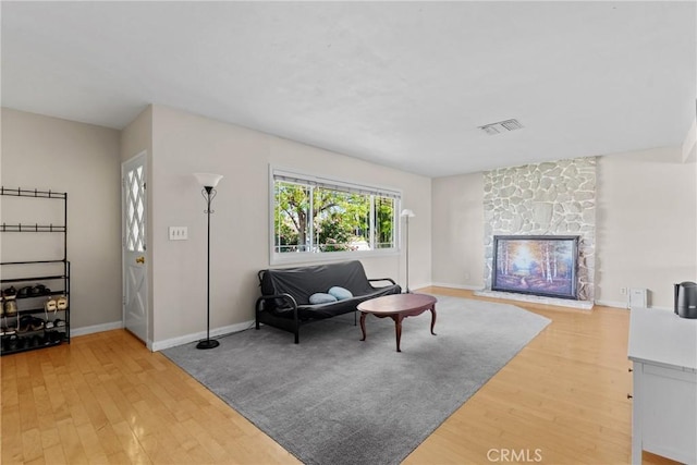 281 Harruby Dr, Calimesa, CA 92320 - living area featuring light wood finished floors, a fireplace, and baseboards