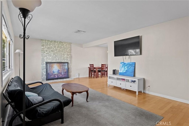 281 Harruby Dr, Calimesa, CA 92320 - living area with a fireplace, wood finished floors, and baseboards