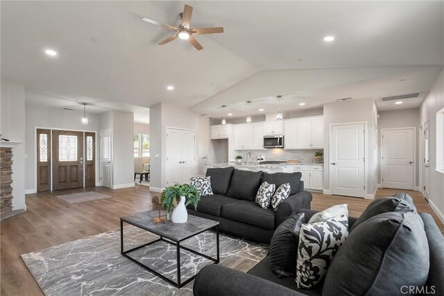 5122 Feather Rock Ct, Paradise, CA 95969 - living room featuring lofted ceiling, a ceiling fan, recessed lighting, light wood-style flooring, and baseboards