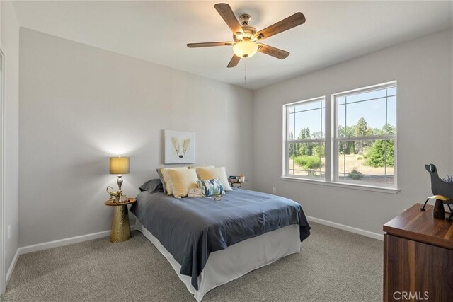 5122 Feather Rock Ct, Paradise, CA 95969 - carpeted bedroom with baseboards and ceiling fan