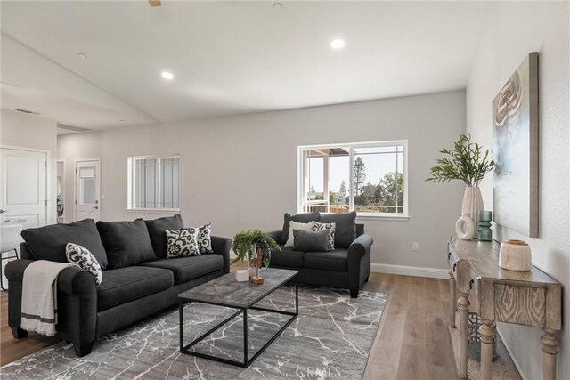 5122 Feather Rock Ct, Paradise, CA 95969 - living room with wood finished floors, vaulted ceiling, recessed lighting, and baseboards