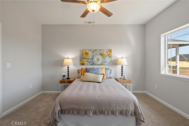 5122 Feather Rock Ct, Paradise, CA 95969 - carpeted bedroom with multiple windows, baseboards, and a ceiling fan
