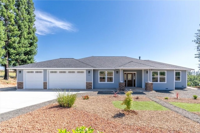 5122 Feather Rock Ct, Paradise, CA 95969 - ranch-style home featuring a garage, concrete driveway, and stone siding