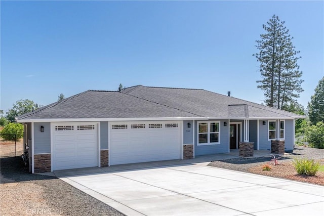 5122 Feather Rock Ct, Paradise, CA 95969 - view of front of property with an attached garage, concrete driveway, stone siding, and a shingled roof