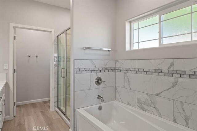 5122 Feather Rock Ct, Paradise, CA 95969 - full bathroom with a bath, wood finished floors, a shower stall, and vanity