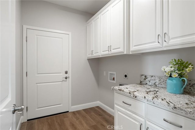 5122 Feather Rock Ct, Paradise, CA 95969 - laundry area with cabinet space, electric dryer hookup, hookup for a washing machine, dark wood-style flooring, and baseboards