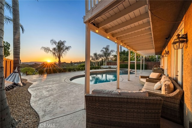 40493 Calle Katerine, Temecula, CA 92591 - pool at dusk with a patio area, a fenced backyard, and an outdoor living space