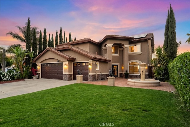 40493 Calle Katerine, Temecula, CA 92591 - mediterranean / spanish house featuring a yard, solar panels, stucco siding, and concrete driveway
