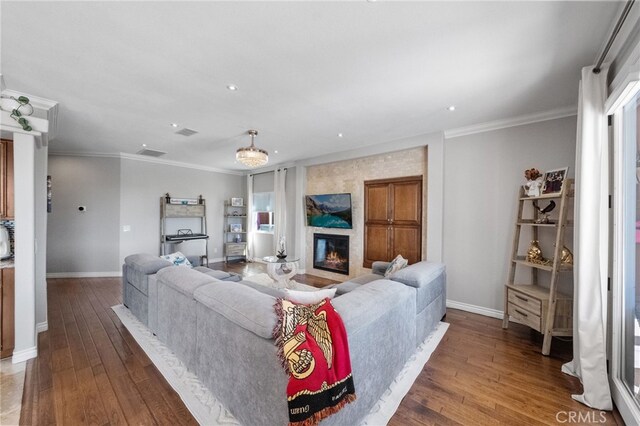 40493 Calle Katerine, Temecula, CA 92591 - living room featuring baseboards, wood-type flooring, a fireplace, crown molding, and recessed lighting