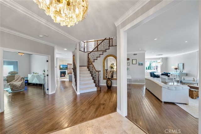 40493 Calle Katerine, Temecula, CA 92591 - foyer entrance featuring a chandelier, stairway, wood-type flooring, ornamental molding, and baseboards