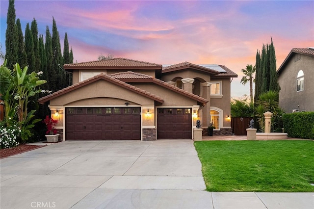40493 Calle Katerine, Temecula, CA 92591 - mediterranean / spanish-style house with solar panels, a garage, a yard, concrete driveway, and stucco siding