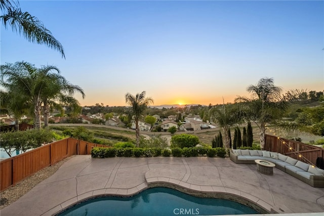 40493 Calle Katerine, Temecula, CA 92591 - view of pool featuring a patio, an outdoor living space with a fire pit, and a fenced backyard