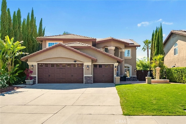 40493 Calle Katerine, Temecula, CA 92591 - mediterranean / spanish house featuring stucco siding, an attached garage, concrete driveway, a tiled roof, and a front lawn