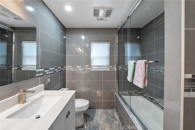 40493 Calle Katerine, Temecula, CA 92591 - full bathroom with tile walls, vanity, toilet, and tiled shower / bath combo