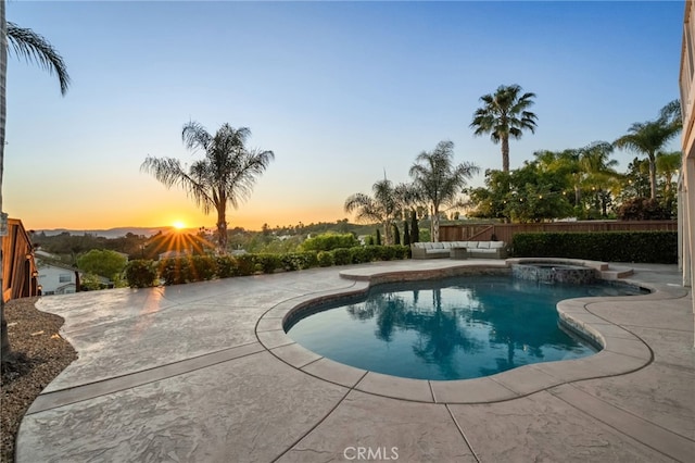 40493 Calle Katerine, Temecula, CA 92591 - pool at dusk featuring a patio area, an outdoor hangout area, and a pool with connected hot tub