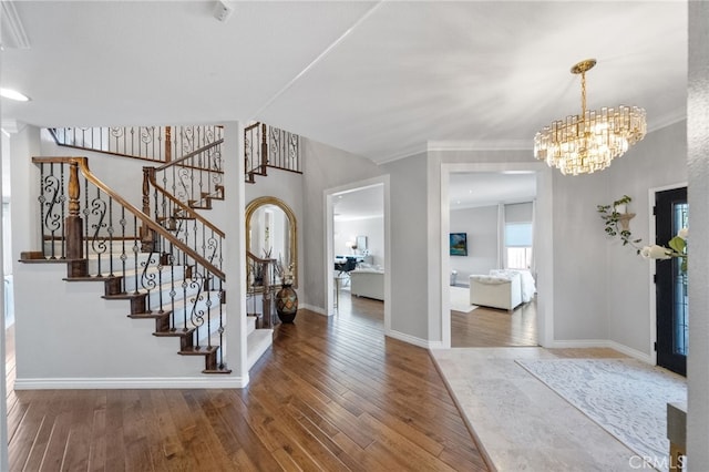40493 Calle Katerine, Temecula, CA 92591 - entrance foyer featuring hardwood / wood-style flooring, baseboards, stairway, a chandelier, and ornamental molding