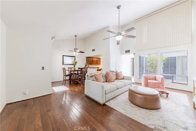 38970 Paseo De Oro, Murrieta, CA 92563 - living area featuring a ceiling fan, dark wood finished floors, high vaulted ceiling, and baseboards