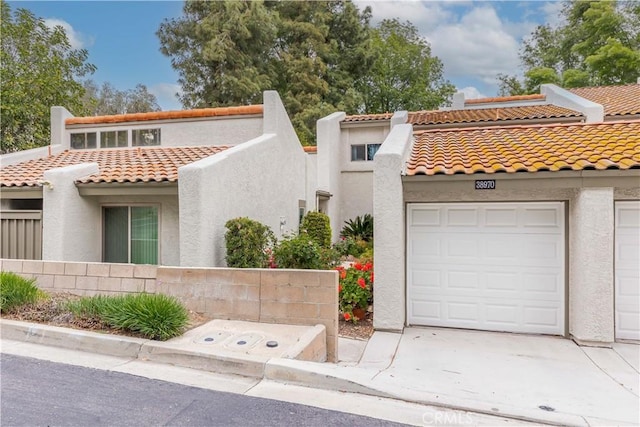 38970 Paseo De Oro, Murrieta, CA 92563 - mediterranean / spanish-style house with stucco siding, a tiled roof, and a garage