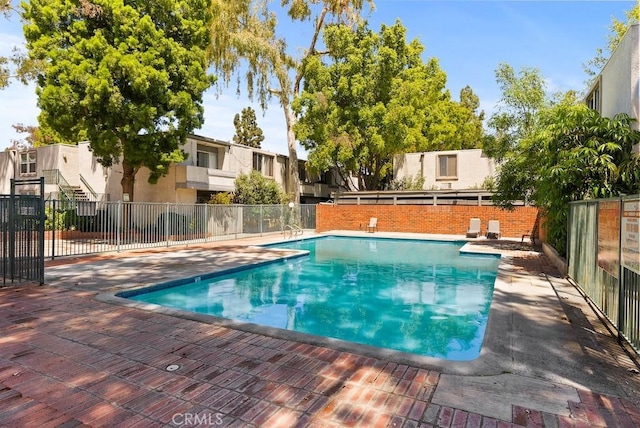 18620 Hatteras St Unit 223, Tarzana, CA 91356 - community pool with fence, a patio, and a residential view
