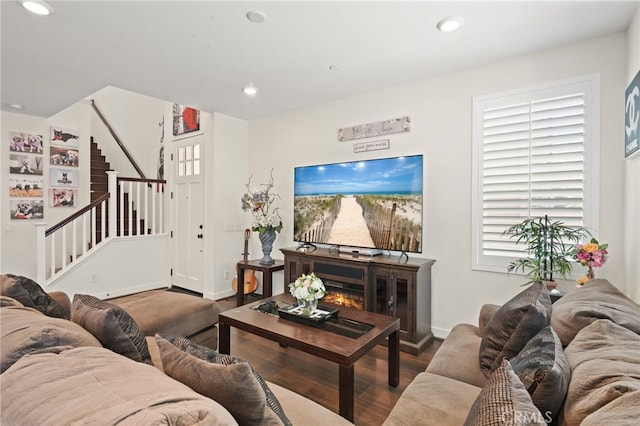 living area featuring stairs, wood finished floors, recessed lighting, and baseboards