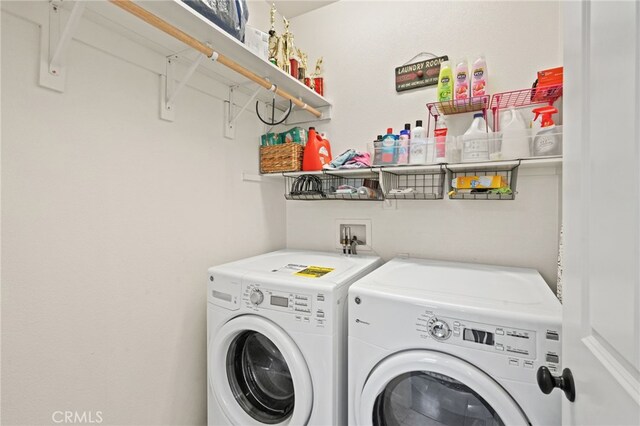 laundry area featuring washing machine and clothes dryer